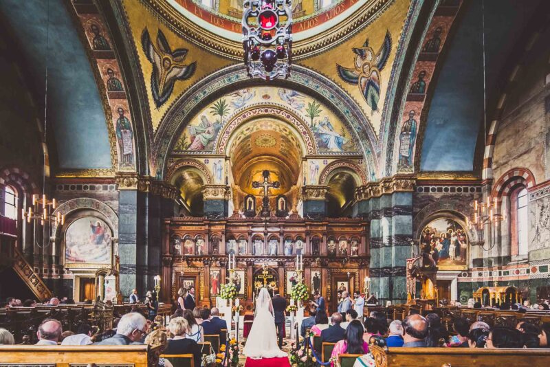 A wedding ceremony in an ornate church.