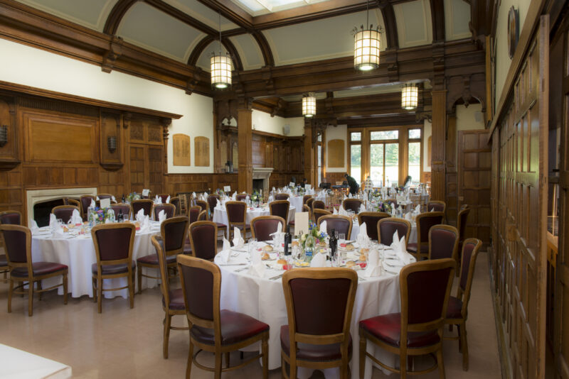 A room with tables and chairs for Bromley wedding photographer.