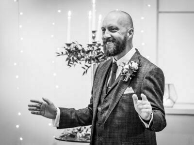 A black and white photo of a man giving a speech.